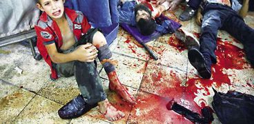 دماء ضحايا سقوط قذائف فى اللاذقية بسوريا أمس