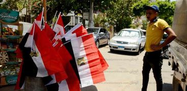 بائعو الأعلام حزينون بعد خروج المنتخب من دور الـ16