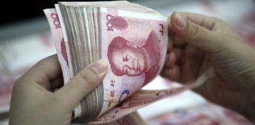 ضم «اليوان» الصينى إلى سلة العملات يعزز التعامل به على المستوى العالمى والمحلى
