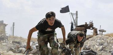 مقاتلون بالمعارضة المسلحة فى إحدى معارك حلب
