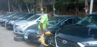 خلال حملات الجيزة لمواجهه غسيل السيارات بالشوارع