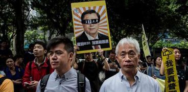 بالصور| احتجاجات في هونج كونج على زيارة مسؤول صيني بارز