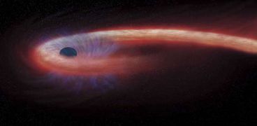 حفرة سوداء تبتلع كوكبا على بعد 740 مليون سنة ضوئية
