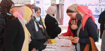 أول معرض لمشروع تمكين بائعات الأسماك في مصر