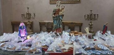 توزيع قرص العذراء مريم