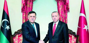 الرئيس التركي رجب طيب أردوغان ورئيس حكومة الوفاق الوطني فايز السراج