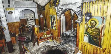 «كنائس ملوي» بعد الاعتداء عليها من «الإرهابية» بعد فض «رابعة» «صورة أرشيفية»