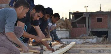 إعادة بناء أسقف 20منزلا للفقراء والأرامل بأسيوط