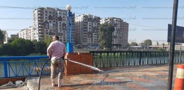 حملة نظافة شاملة لشارع أحمد حسن الباقوري بدءًا من الممشى السياحي وحتى قناطر أسيوط الجديدة