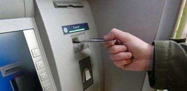 ماكينة ATM- الشمول المالي