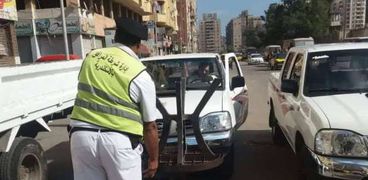 أمن الأسكندرية يشن حملة مكبرة لإزاله الإشغالات بالصريق العام