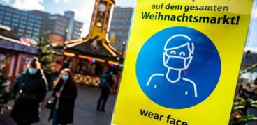 لافته في المانيا تطالب المواطنين بارتدائء الكمامات بسبب كورونا